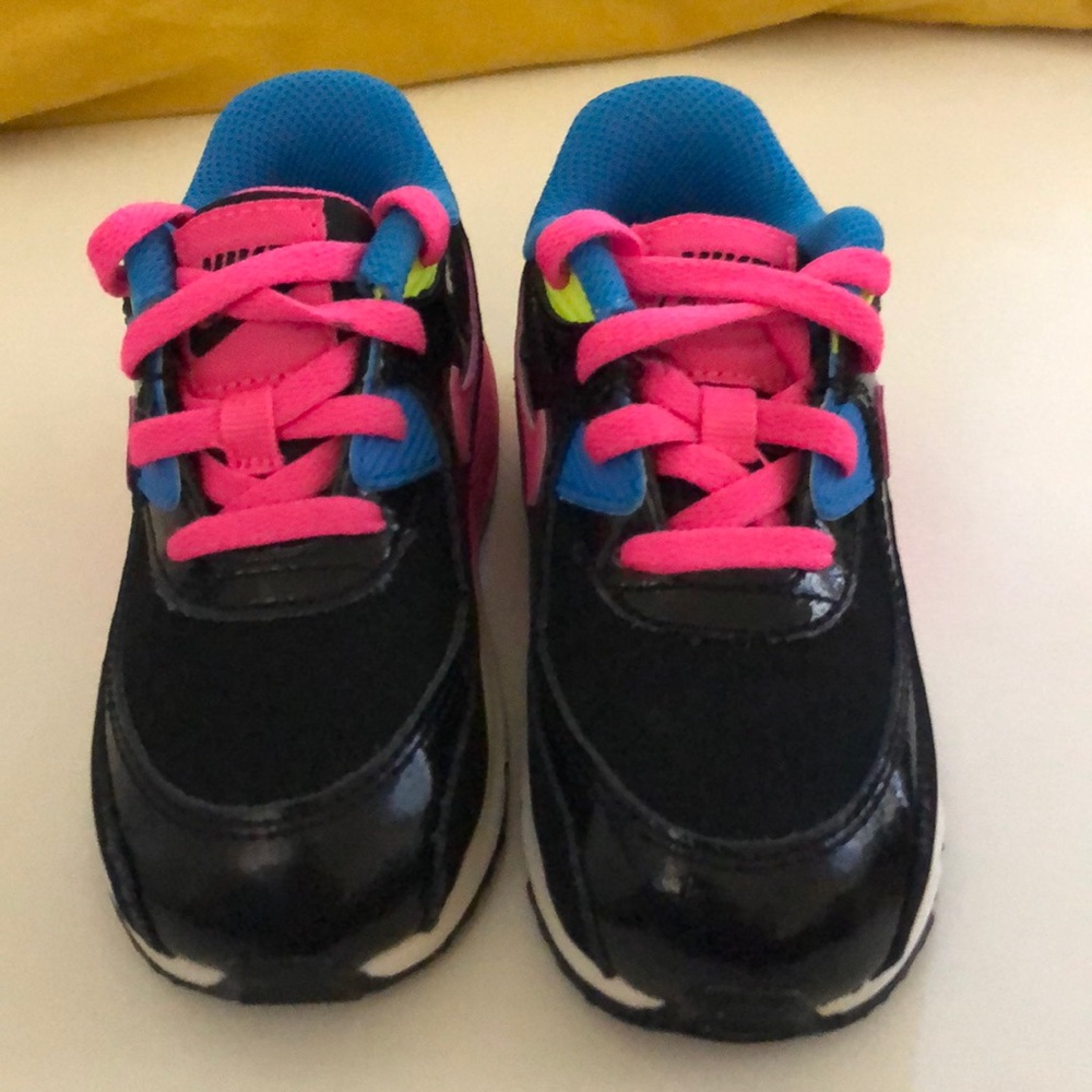 Black, bright pink, and blue air max nike